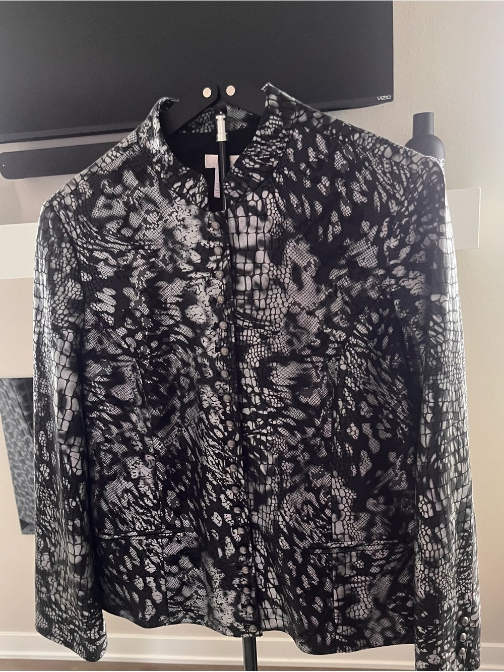 Women’s Chico's black and silver metallic snake print jacket. Size 2 US L-12